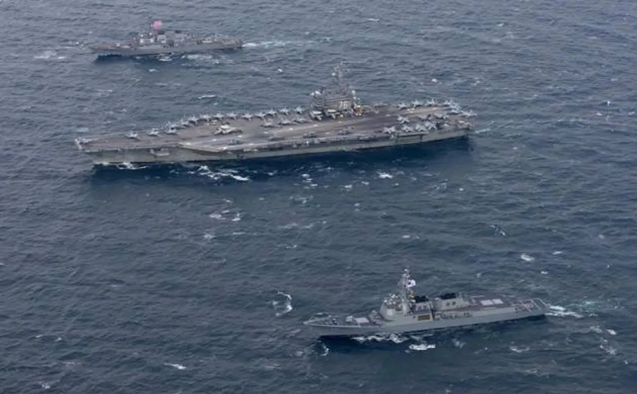China warns of counter measures after US warship sails through