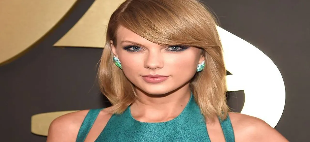 Man robs bank to impress Taylor Swift, throws loot over her fence