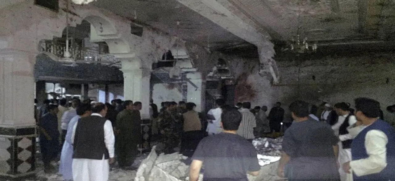 Twin suicide blasts kill at least 20 inside Afghan Shiite mosque