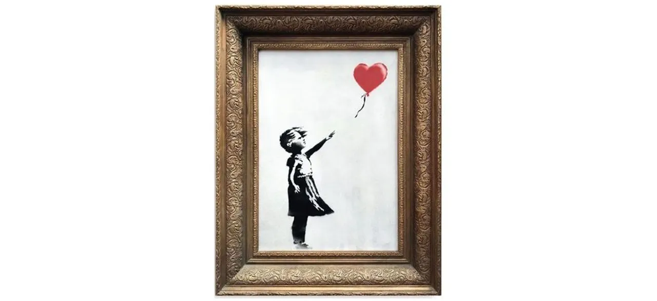 Banksy artwork shreds itself after selling for 1 million pound at auction