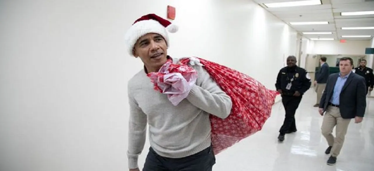 Christmas: Santa Barack Obama delivers presents to kids at Childrenâ€™s Hospital