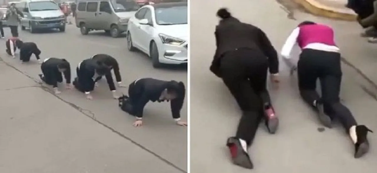 Staff at a Chinese company forced to CRAWL on the street after failing to hit their 'annual targets'
