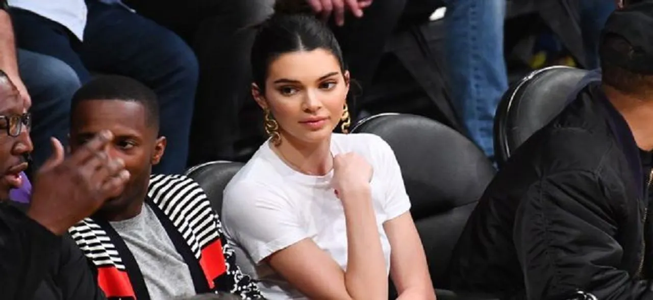 Plastic booties and the Jenners, after Kylie, Kendall spotted wearing plastic heels for a Play Ball game