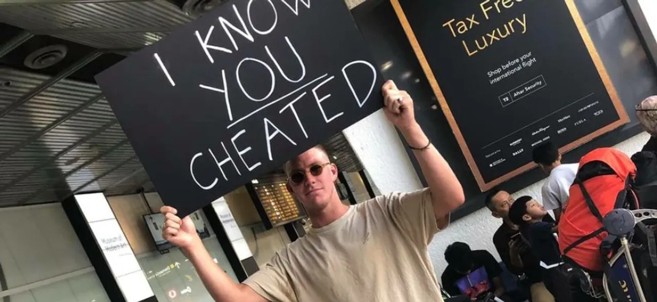 This man confronts his cheating partner at the Melbourne airport in the most HILARIOUS way 