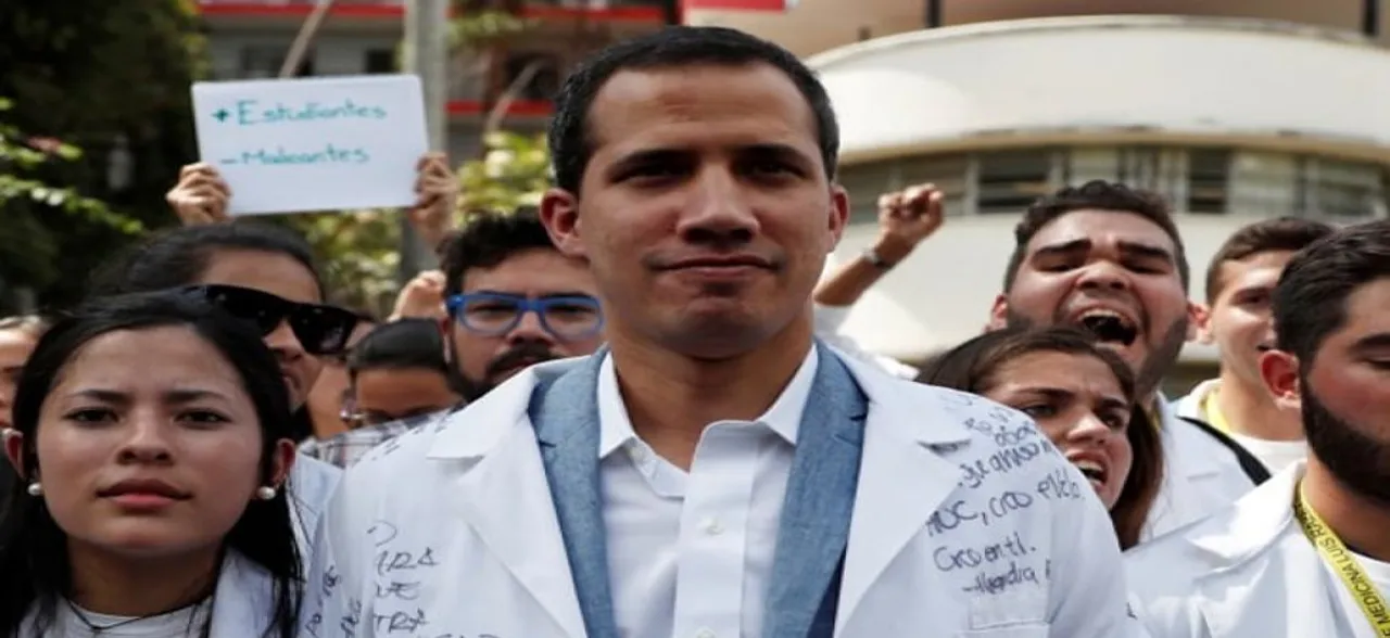 Venezuela's Juan Guaido to leave for Colombia as aid standoff hardens
