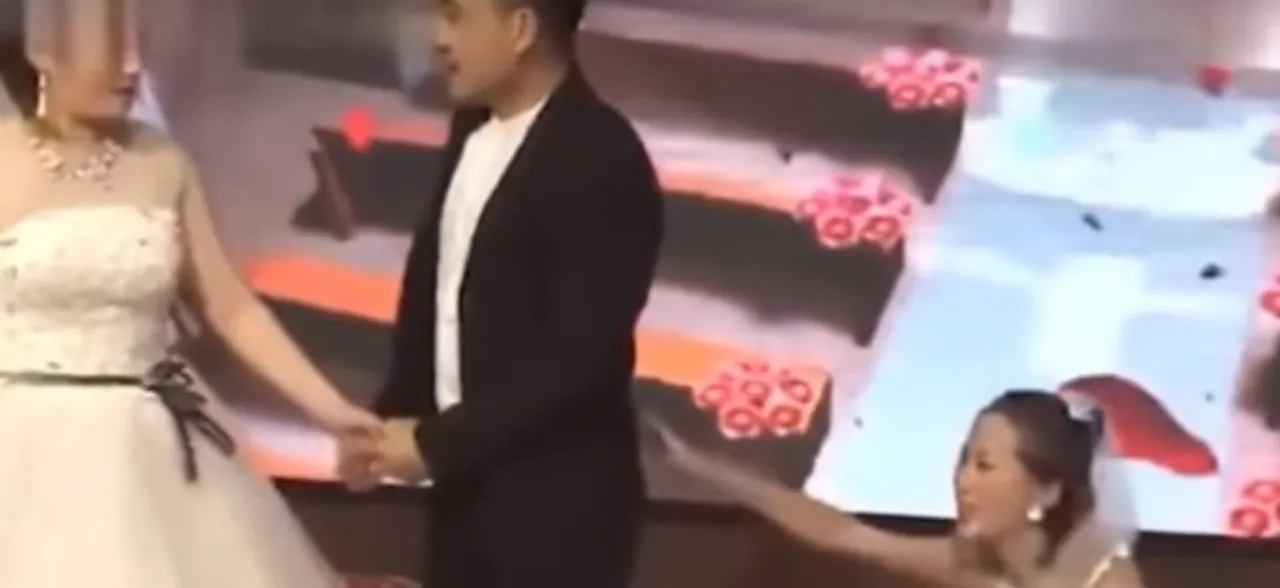Watch VIDEO: Woman dressed as bride crashes her ex-boyfriendâ€™s wedding, begs him to come back 