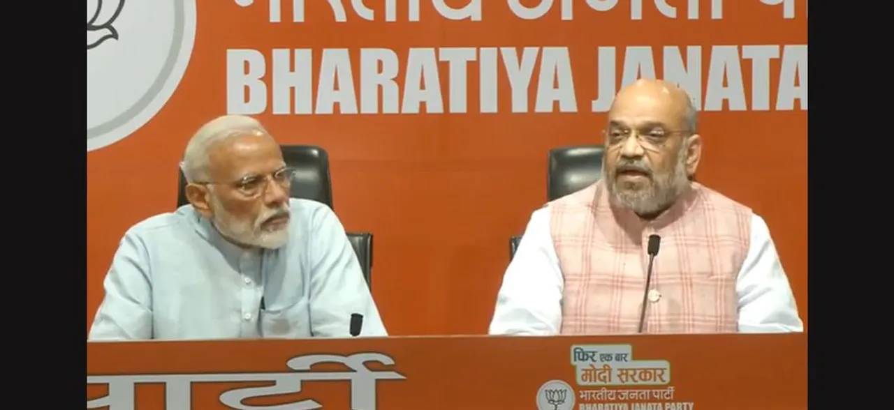 In first media event, PM Modi diverts questions to Amit Shah, predicts complete majority for BJP