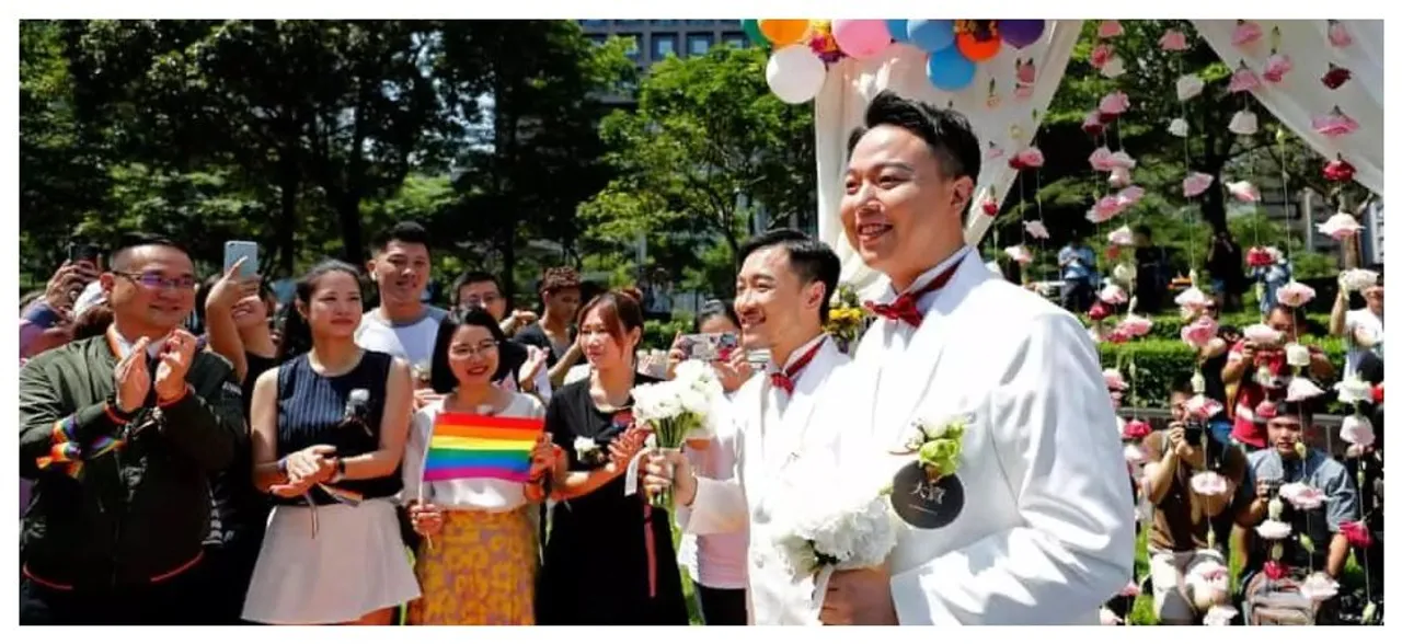Hundreds of couples tie the knot on the first day of legal same-sex marriage in Taiwan