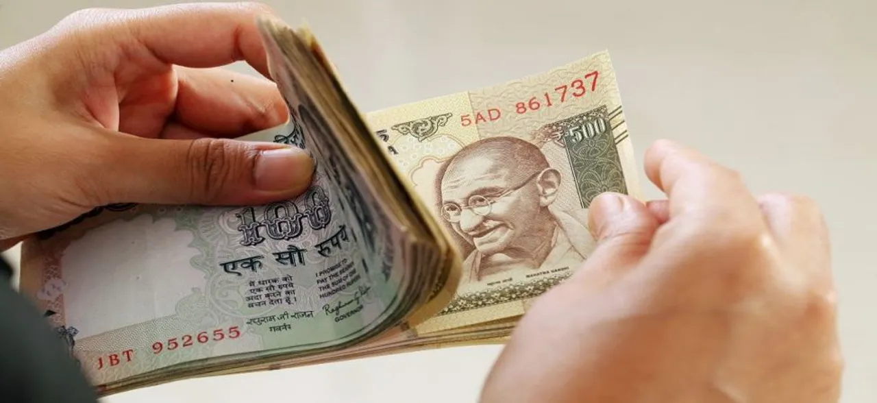 Rupee pares gains, settles 19 paise lower against US dollar
