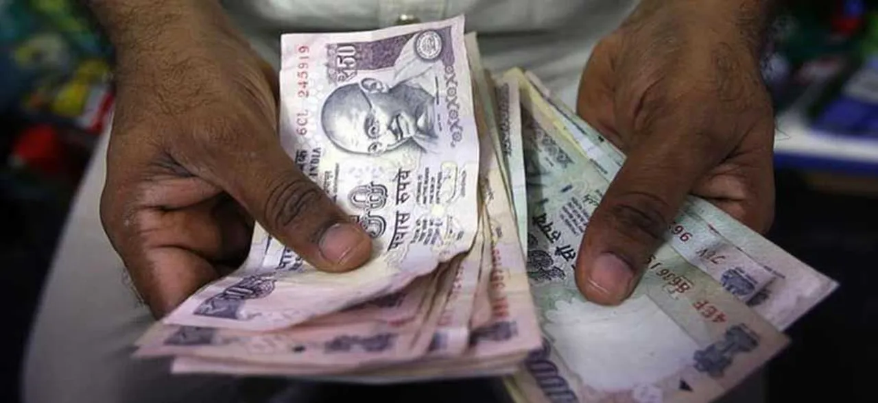 Rupee slips 11 paise to 69.05 against US dollar in early trade