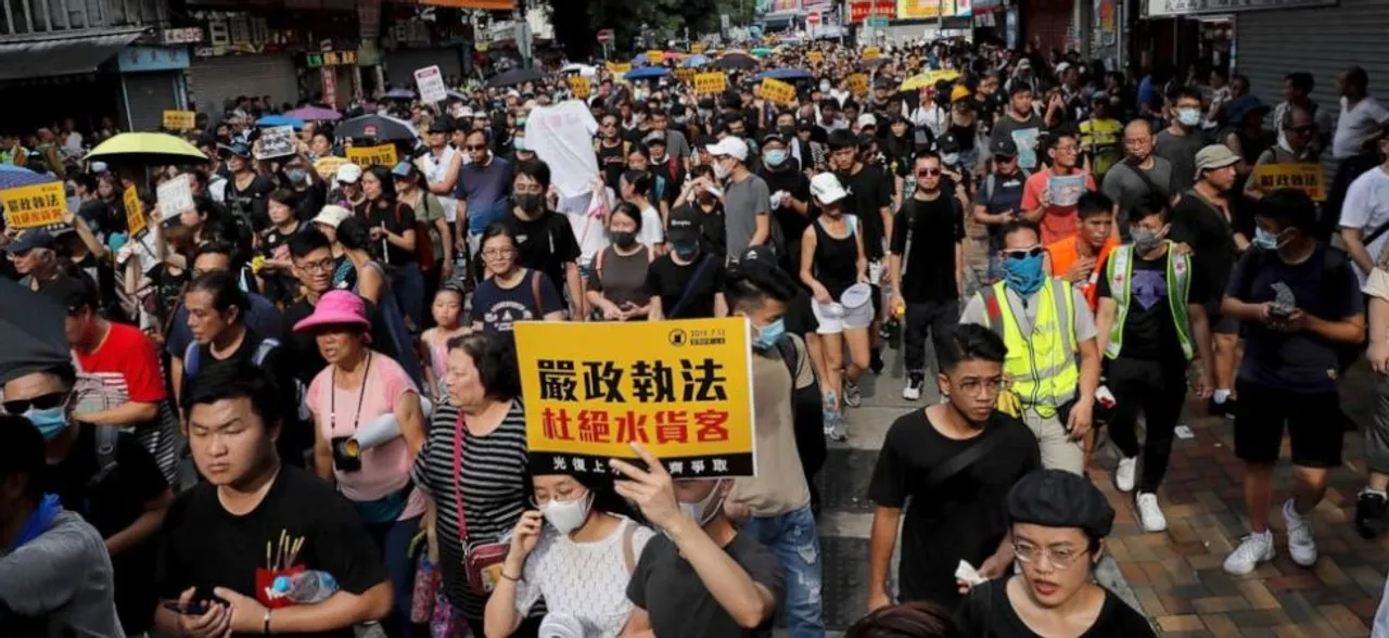 Clashes erupt as Hong Kong protest targets Chinese traders