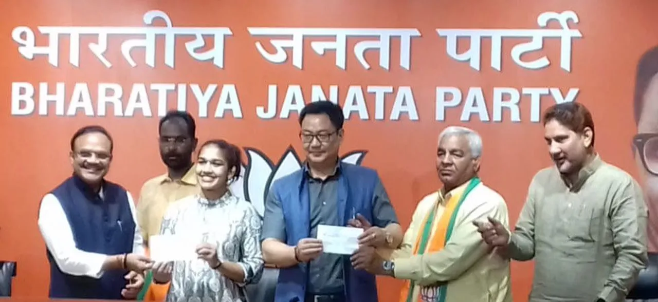 Wrestler Babita Phogat, her father Mahavir join BJP in presence of Union Minister Kiren Rijiju