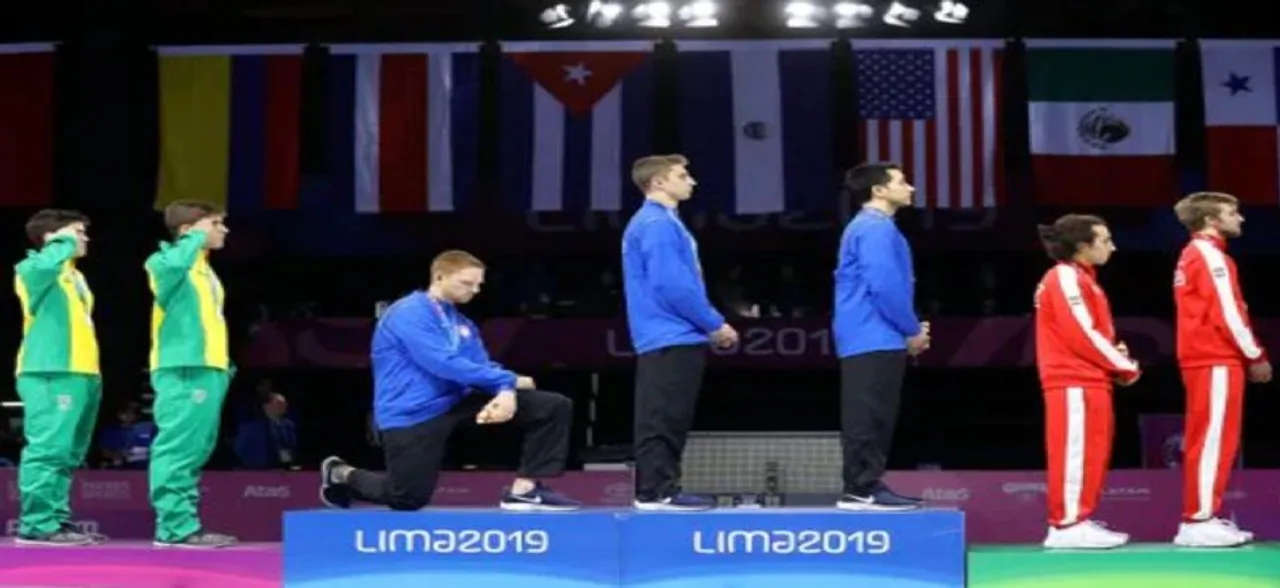 Two US athletes stage protest over President Donald Trump's policies, face warning