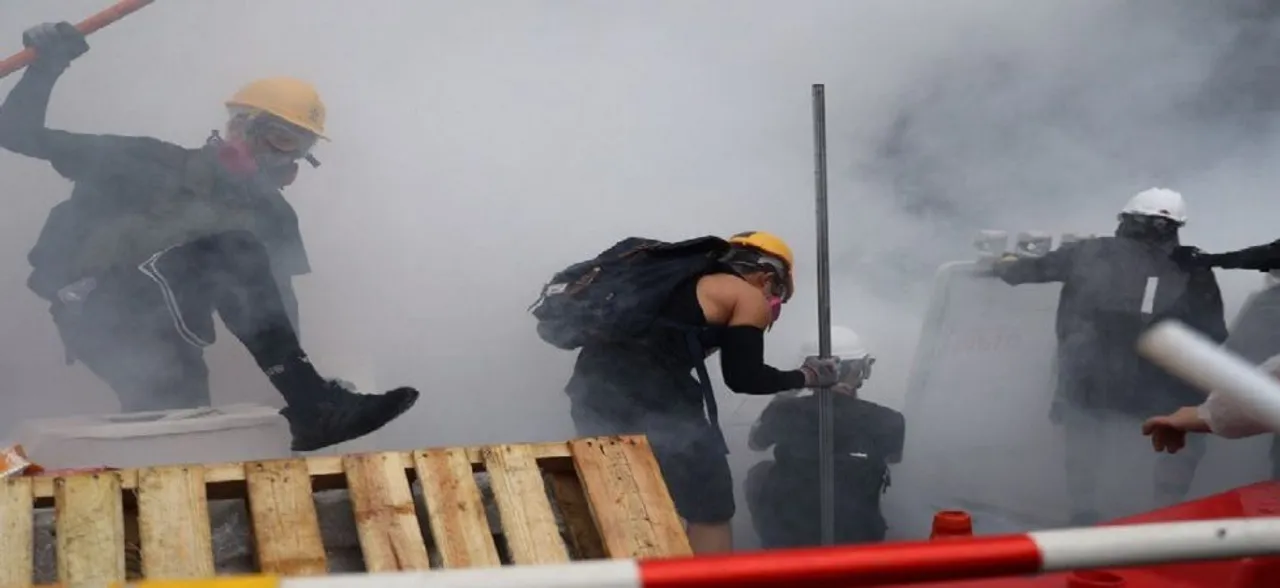 Hong Kong police fires water cannon at protesters for first time during clashes 
