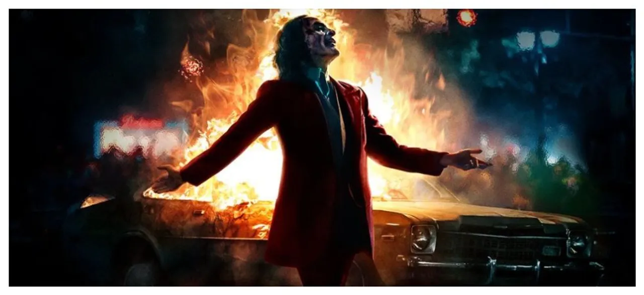 Joaquin Phoenix Laughs As The City Burns In New â€˜Jokerâ€™ Poster 
