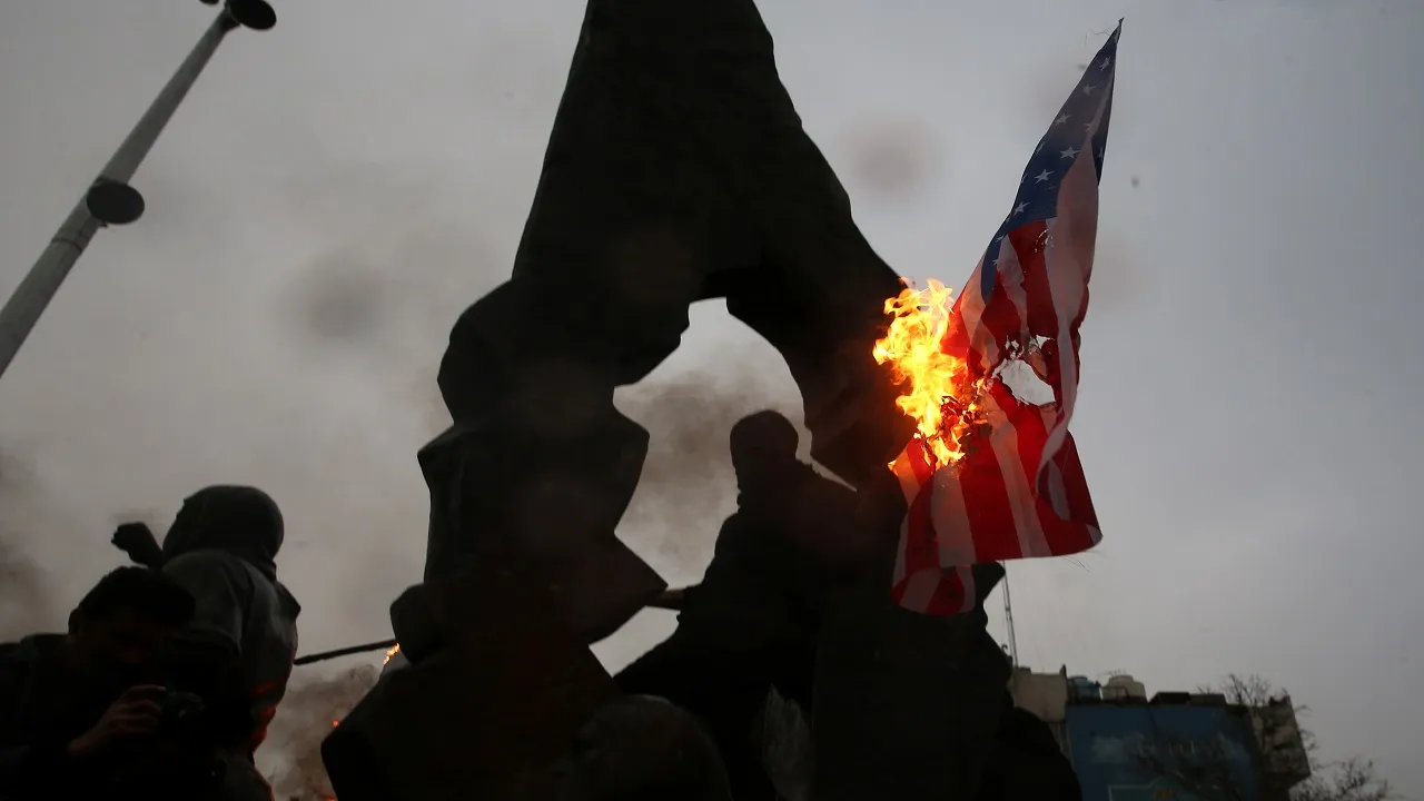 US Flags Burn As Thousands Mourn General In Tehran