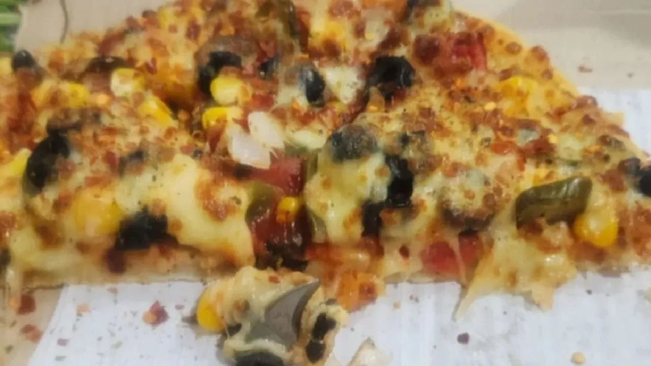 Piece Of Knife in Pizza