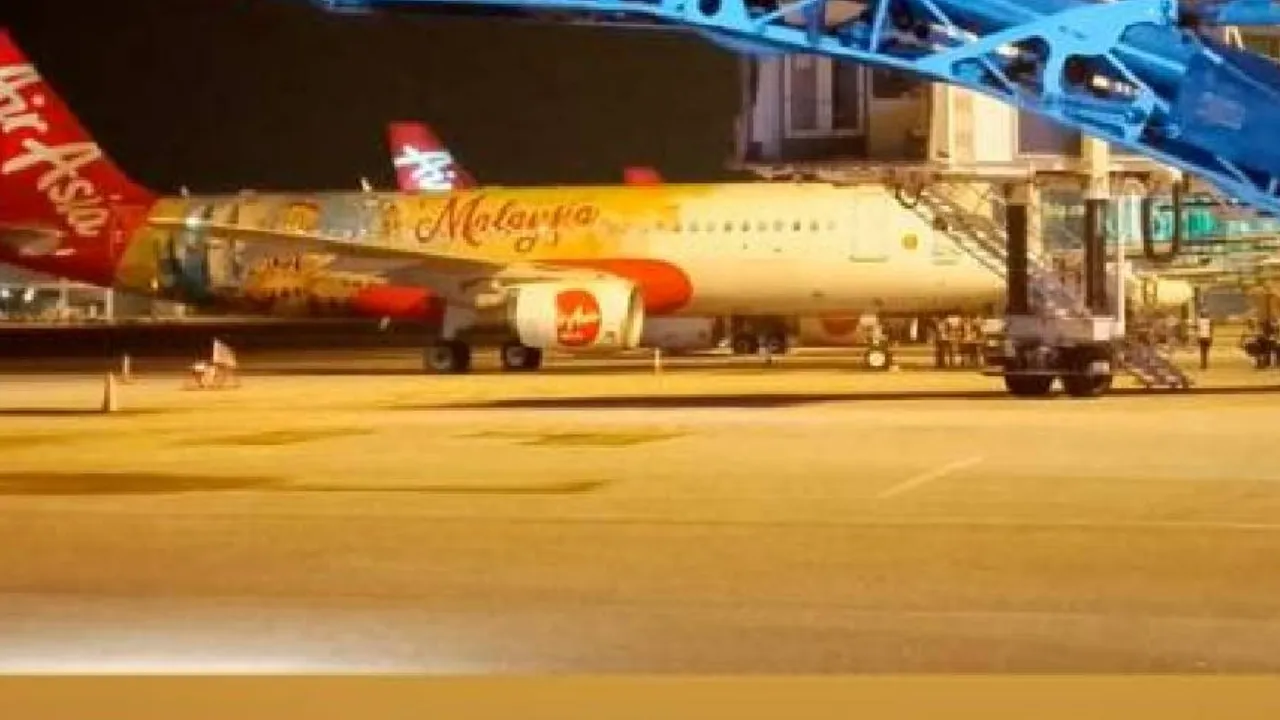 AirAsia Flight Fire Breakout news Emergency Landing in kuala lumpur