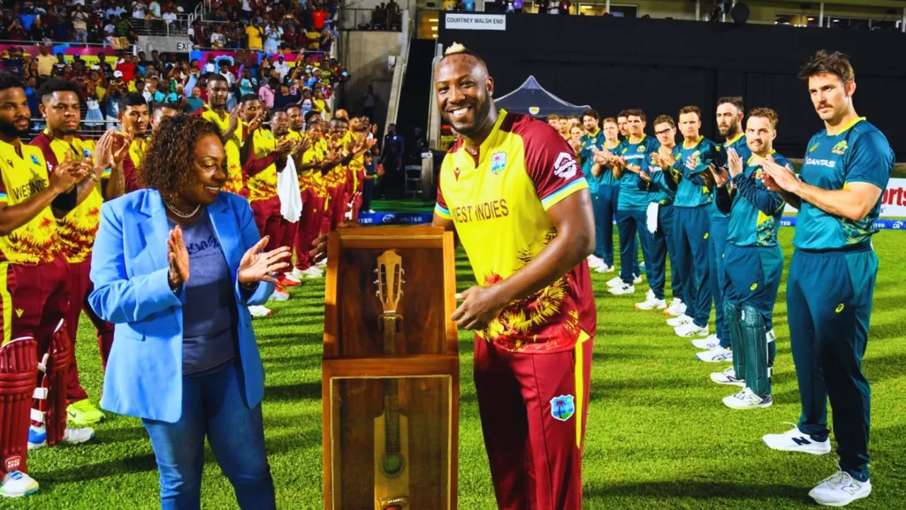 Andre Russell receives a special memento from West Indies on his retirement
