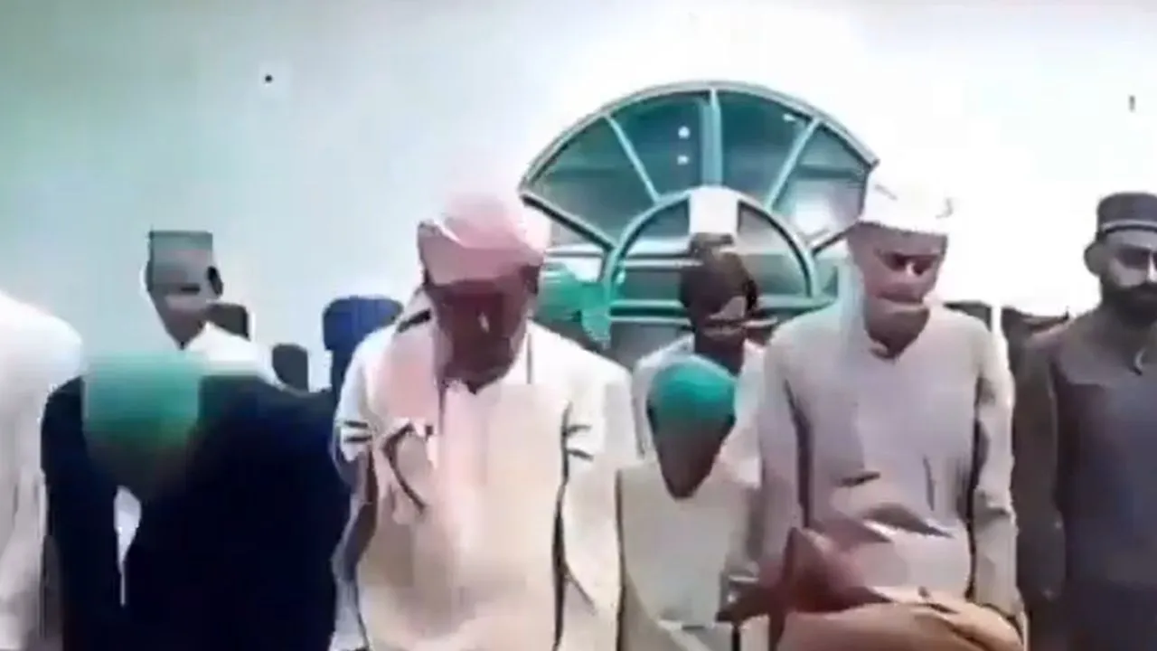 two youths during namaz in the mosque