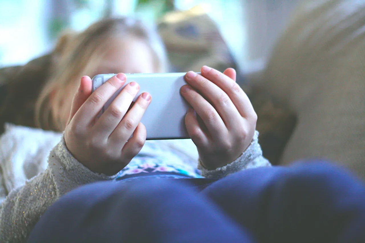 Kids use a smartphone: