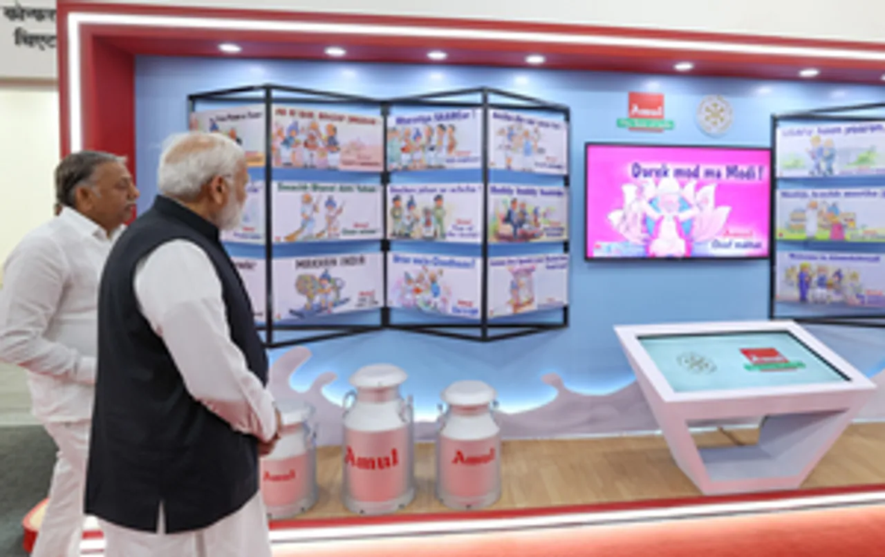 Ahmedabad: Prime Minister Narendra Modi inspects an exhibition by Amul