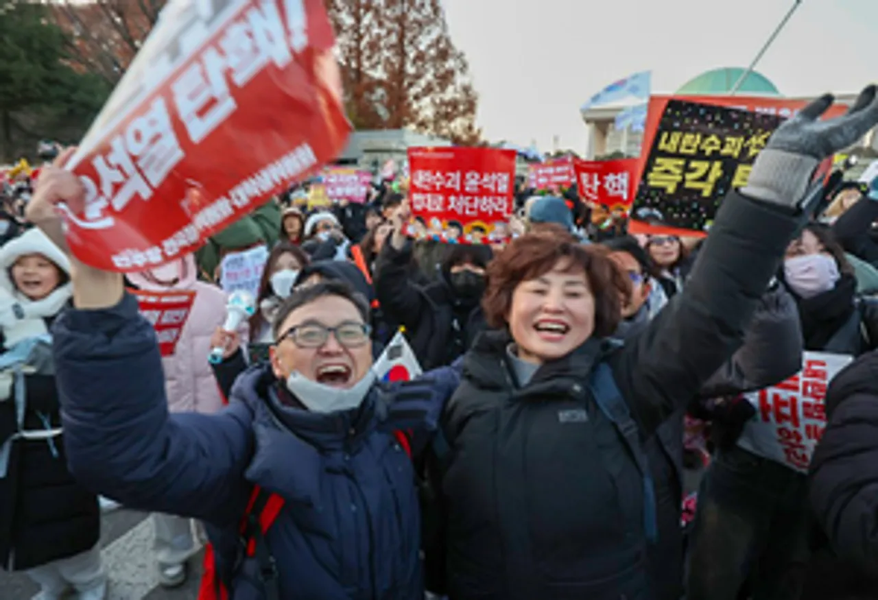 Seoul: Protesters cheer near the National Assembly