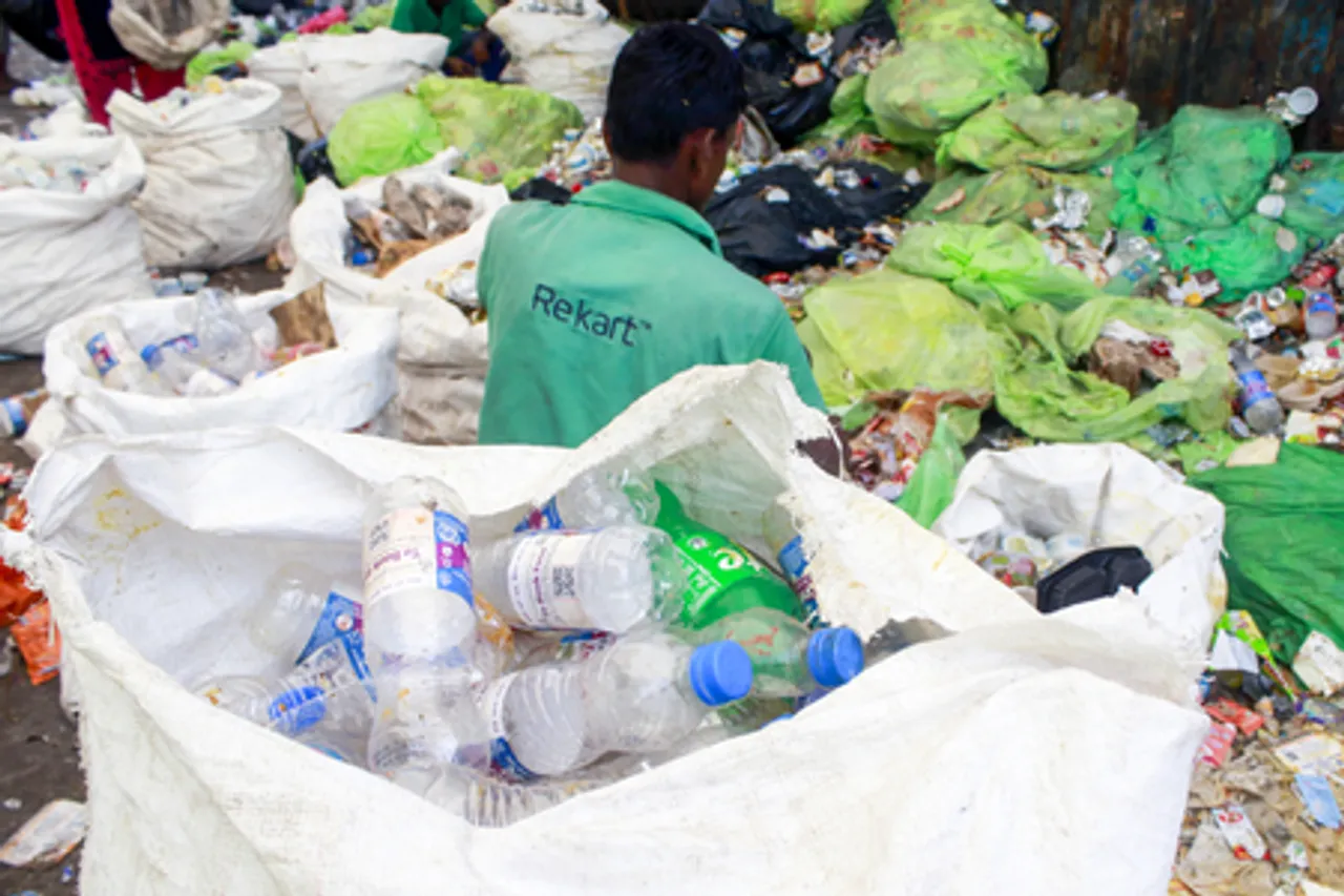 Worker Collects Recyclables Near Ajmeri Gate on Eve of World Environment Day