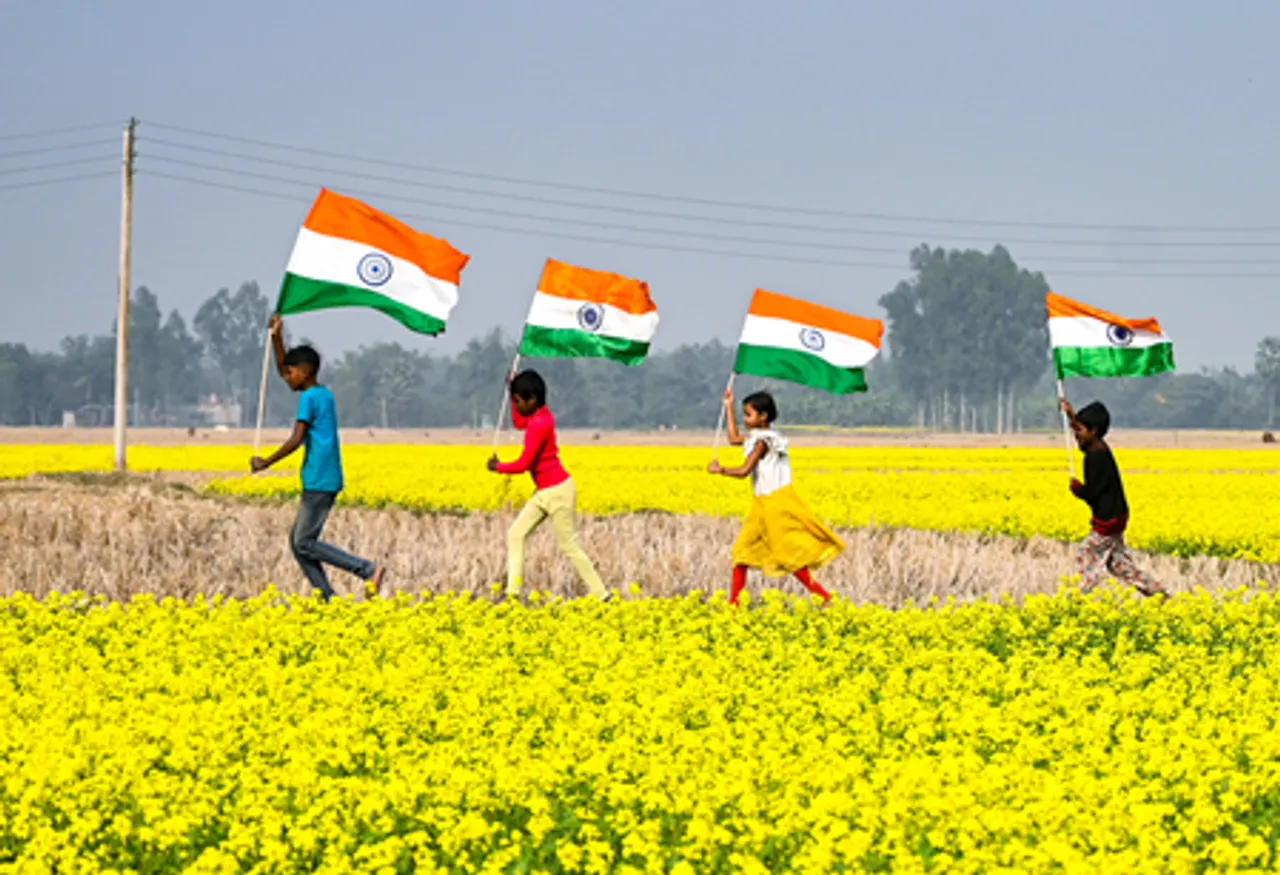 Balurghat: Children Celebrate Republic Day Eve Amid Mustard Fields