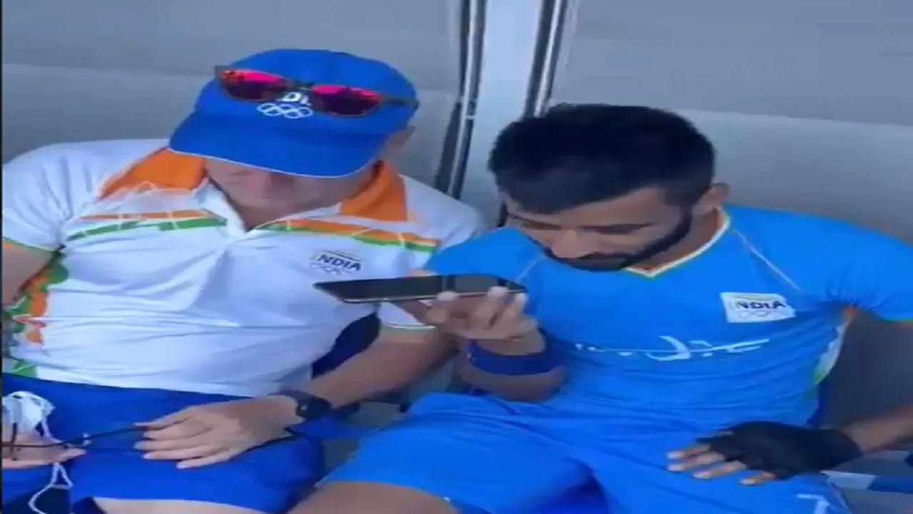 PM Narendra Modi speaks to the India Hockey team