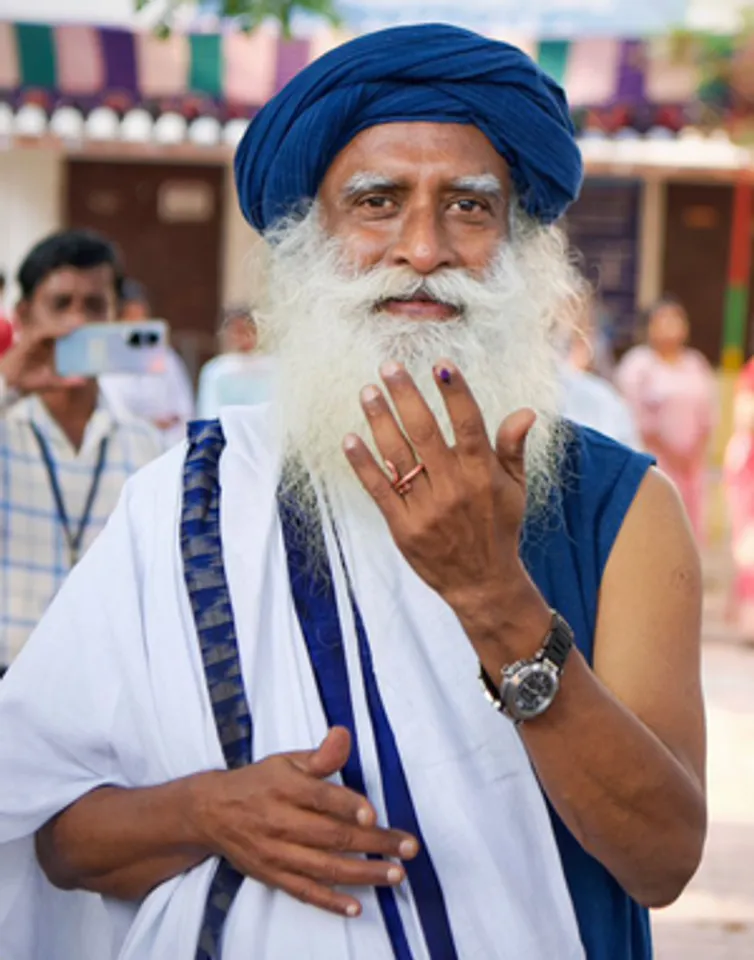 Coimbatore: Spiritual teacher 'Sadhguru' Jaggi Vasudev shows his ink-marked finger after casting his vote during the first phase of Lok Sabha elections