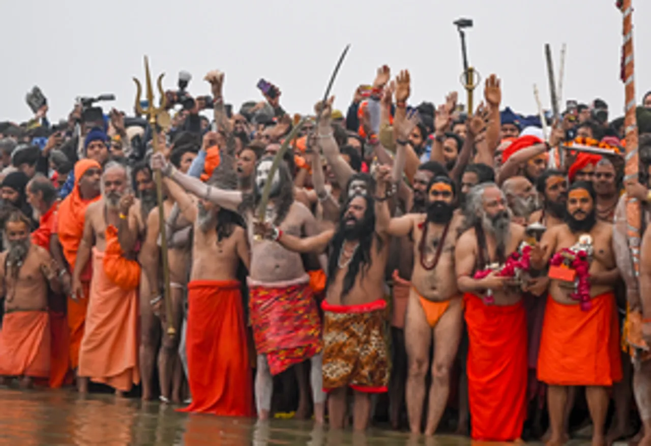Prayagraj: Sadhus of 'Niranjani Akhara' take a holy dip during the 'Amrit Snan' at the Triveni Sangam, confluence of the Ganges, the Yamuna, and the mythical Saraswati rivers, on the auspicious occasion of Makar Sankranti during the Maha Kumbh 2025 in Prayagraj on Tuesday, January 14, 2025. (Photo: IANS/Biplab Banerjee)