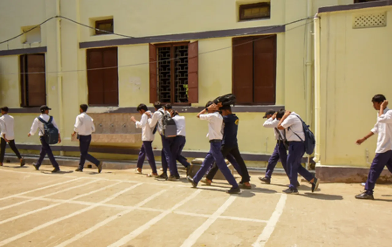 Patna: School students participate in a civil defence mock dril