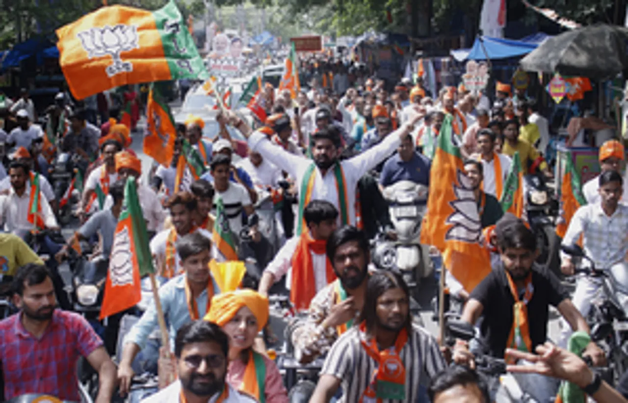 New Delhi:BJP suppoters take part in a election rally