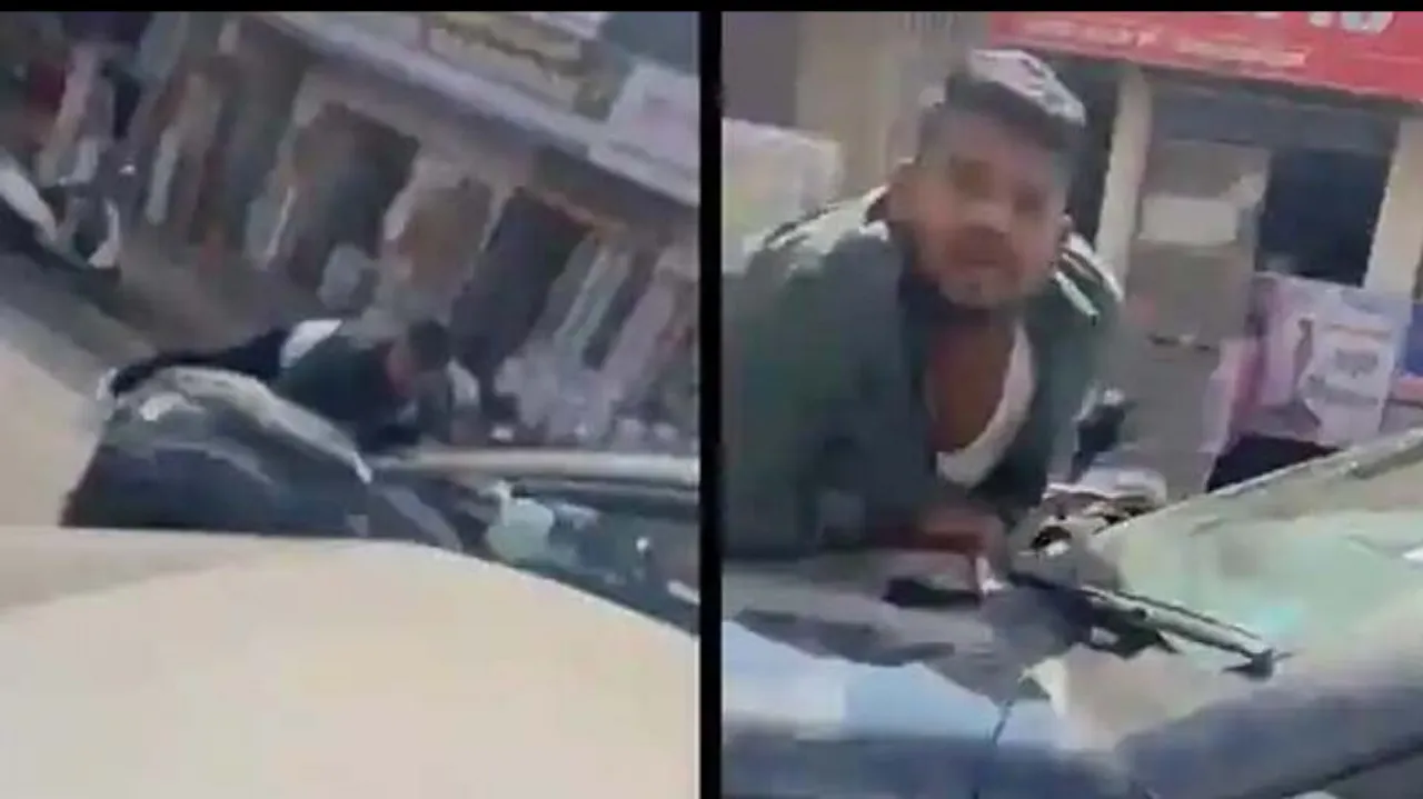 Woman drags man on car bonnet