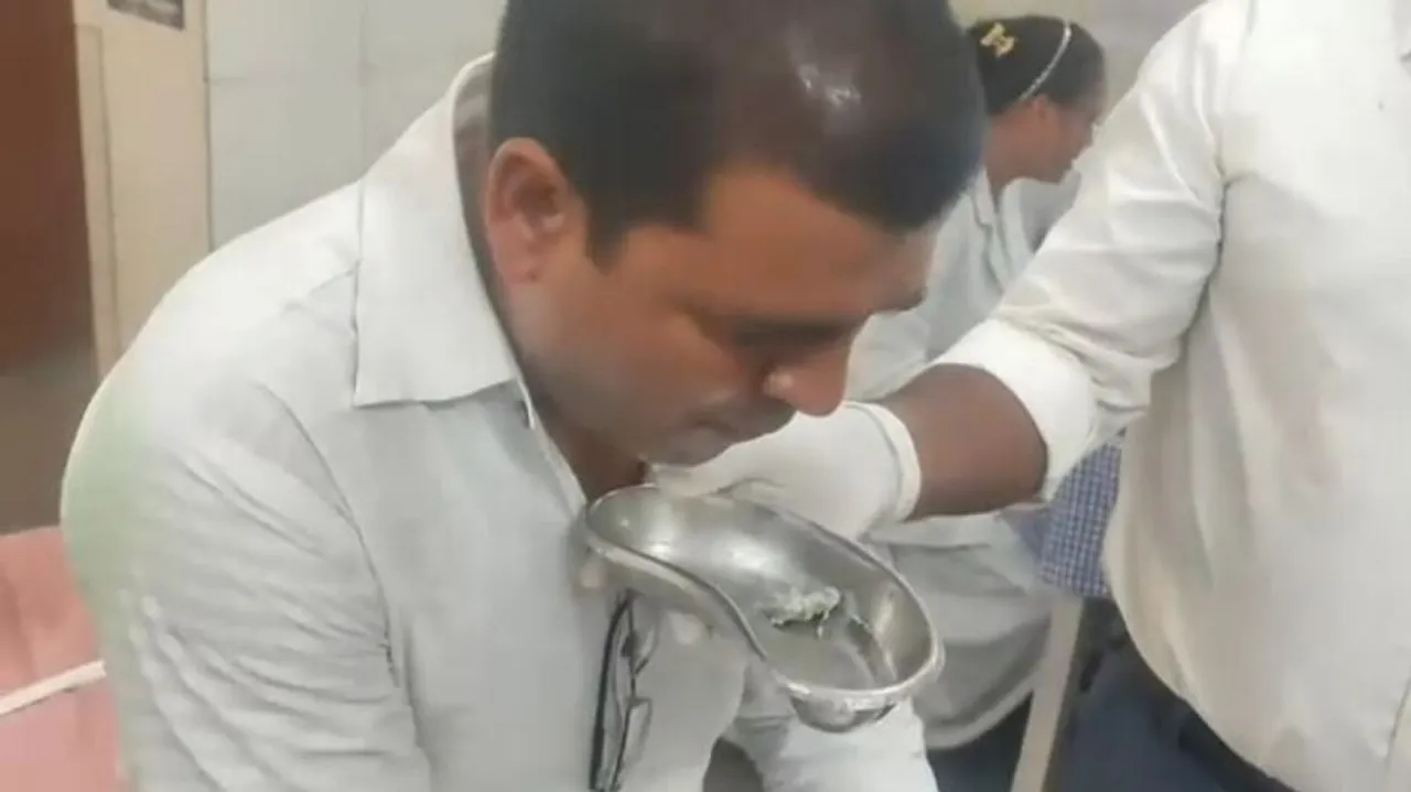 Madhya Pradesh official swallows bribe money 