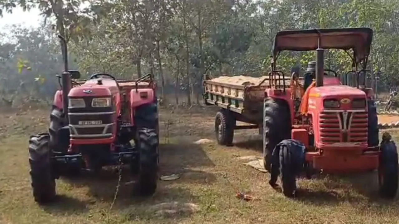 2 illegal sand loading tractors
