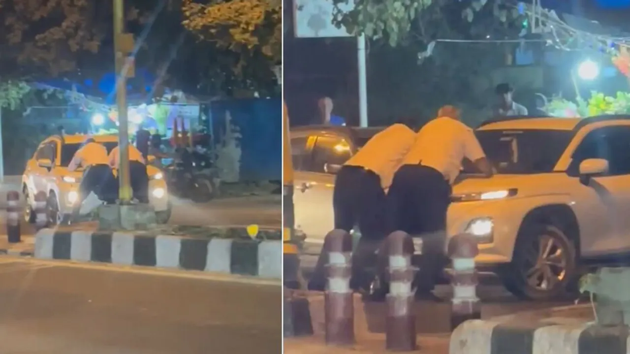 traffic police dragged on car bonnet