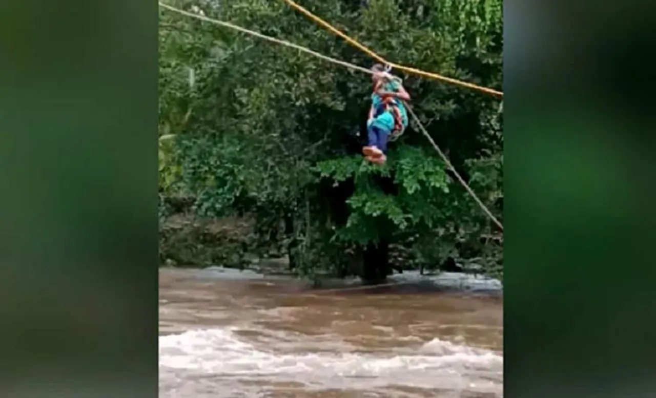 ବନ୍ୟାର ତାଣ୍ଡବ: ରଶିରେ ଝୁଲି ନଦୀ ପାର ହେଲେ ଗର୍ଭବତୀ