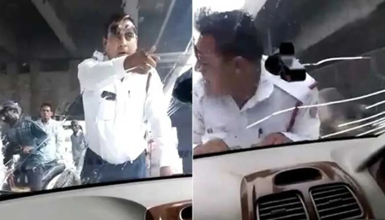 ଚଳନ୍ତା କାର୍‌ର ବନେଟ୍‌ ଉପରେ ଚଢ଼ିଗଲେ ଟ୍ରାଫିକ୍ ପୁଲିସ୍, ଭାଇରାଲ୍‌ ହେଉଛି ଭିଡିଓ