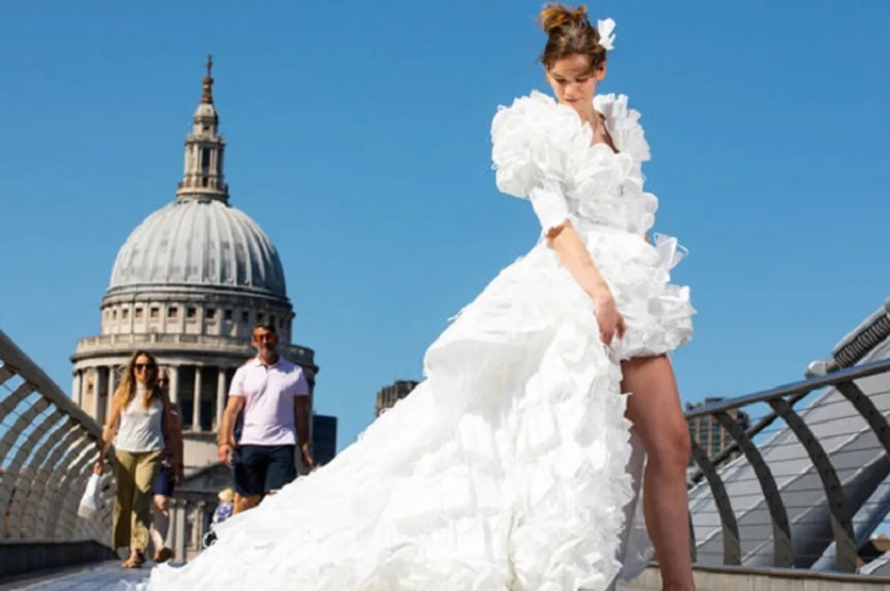 ୱେଡିଂ ଡ୍ରେସ୍‌ରେ ଲୁଚି ରହିଛି ମାସ୍କ