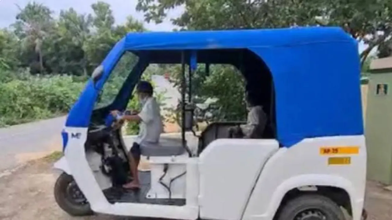 boy driving e-rickshaw wearing school dress