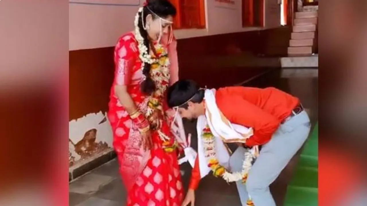 groom takes brides blessings