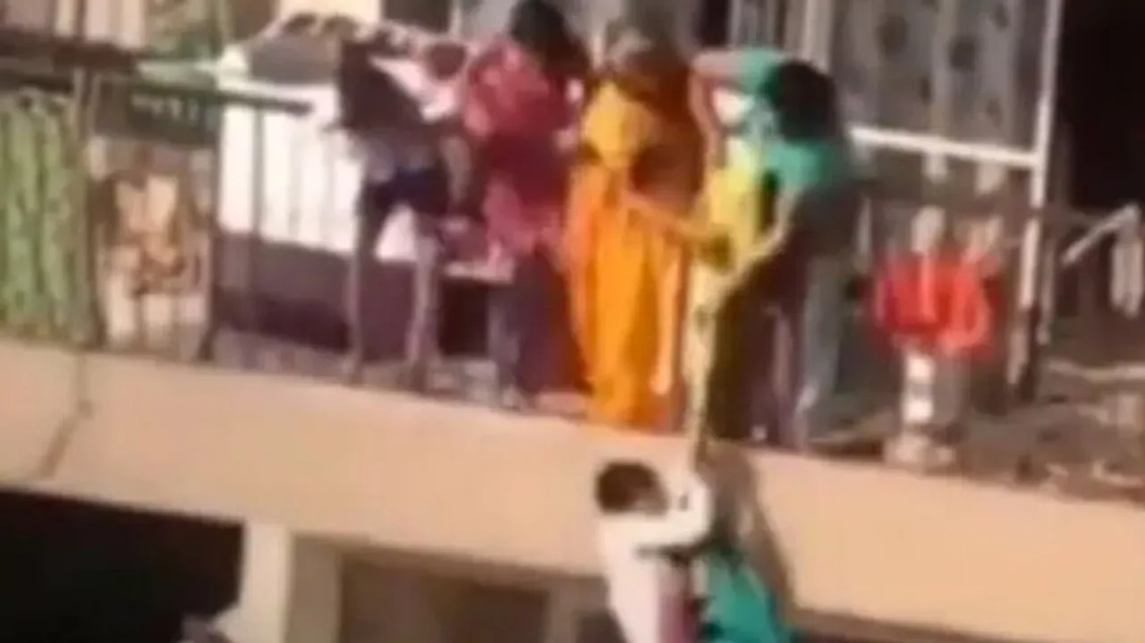 Mother Pulling Child With Help Of A Saree From 10th Floor