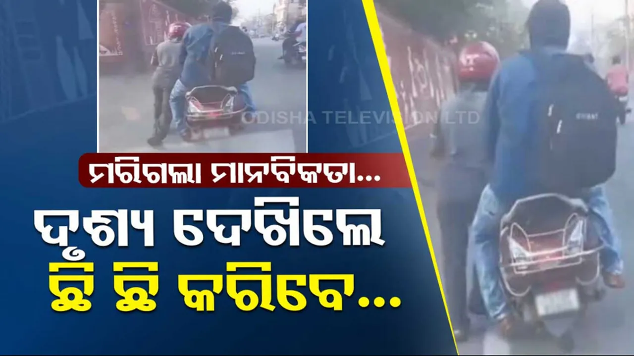  Rapido rider pushes bike with customer sitting on it