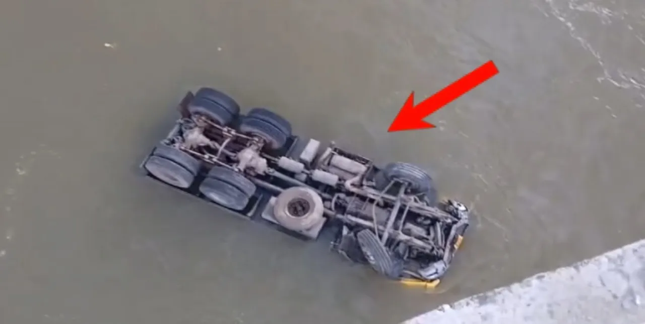 Truck falls off bridge into IB River