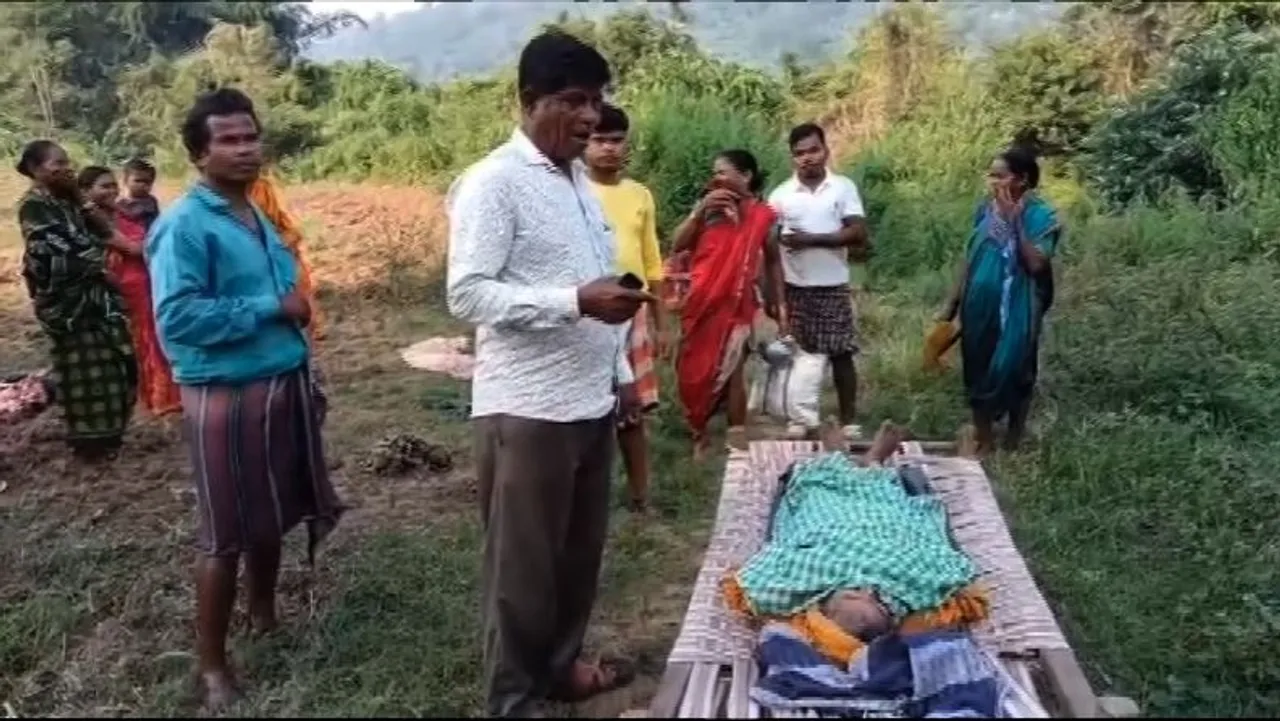 Woman patient carried on cot across flooded stream due to lack of bridge in Odisha