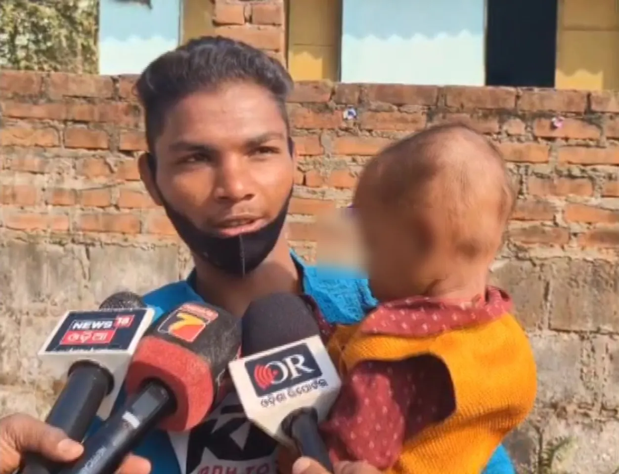 Man waits outside exam centre with 18-month-old child as woman appears for Matric exam