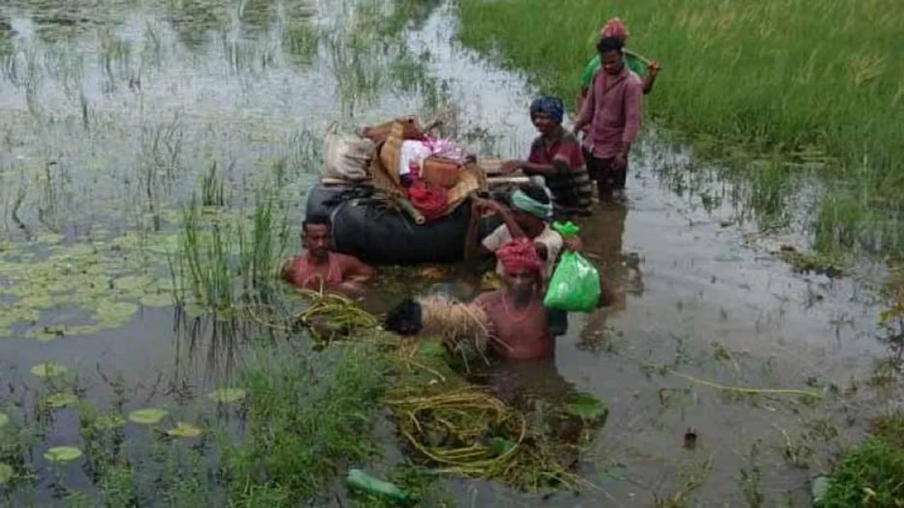 Inflatable Tube Used To Ferry Body Across Marooned Village In Odisha