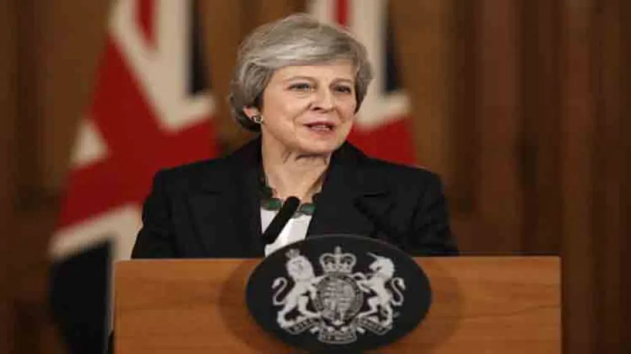 British PM vows to move on with her Brexit plan